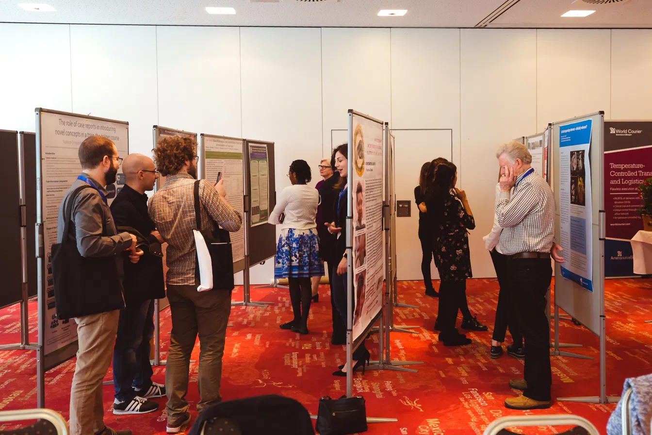 Delegates discussing posters at the poster session